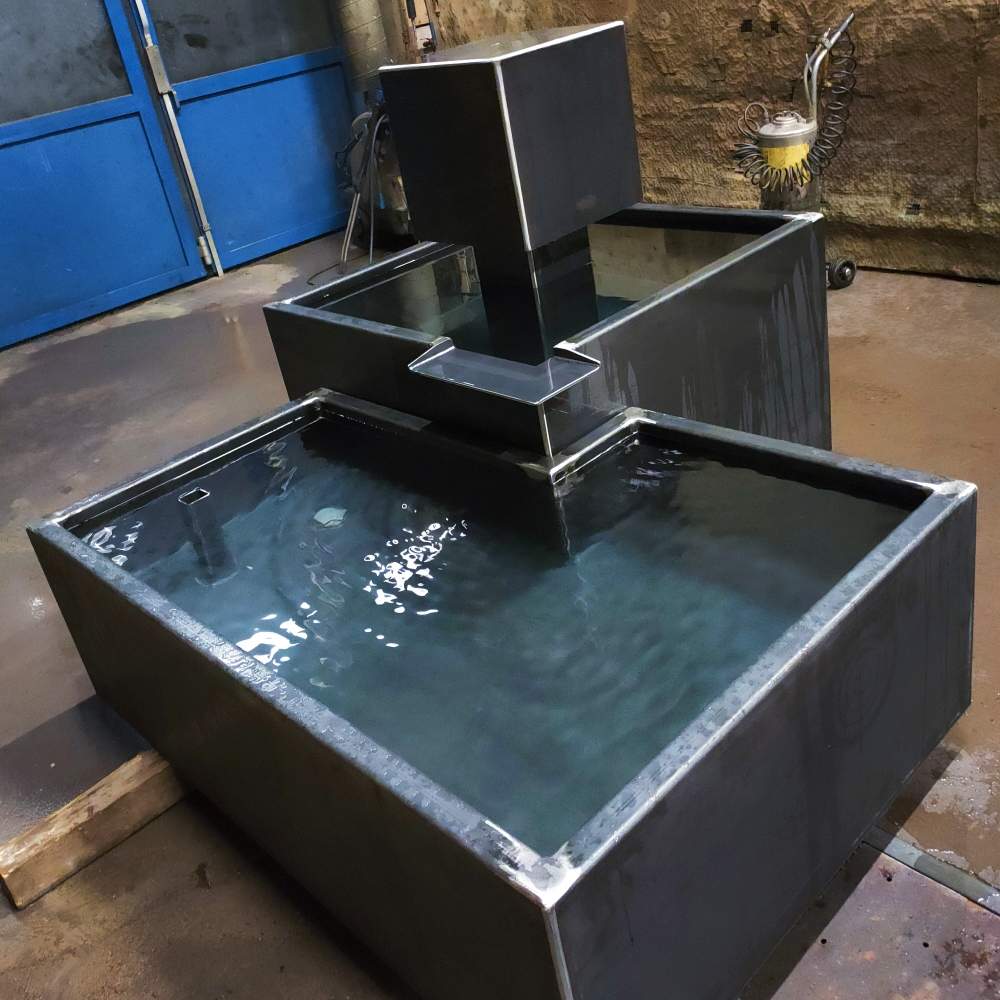 Custom fountain with waterfall and built-in lighting